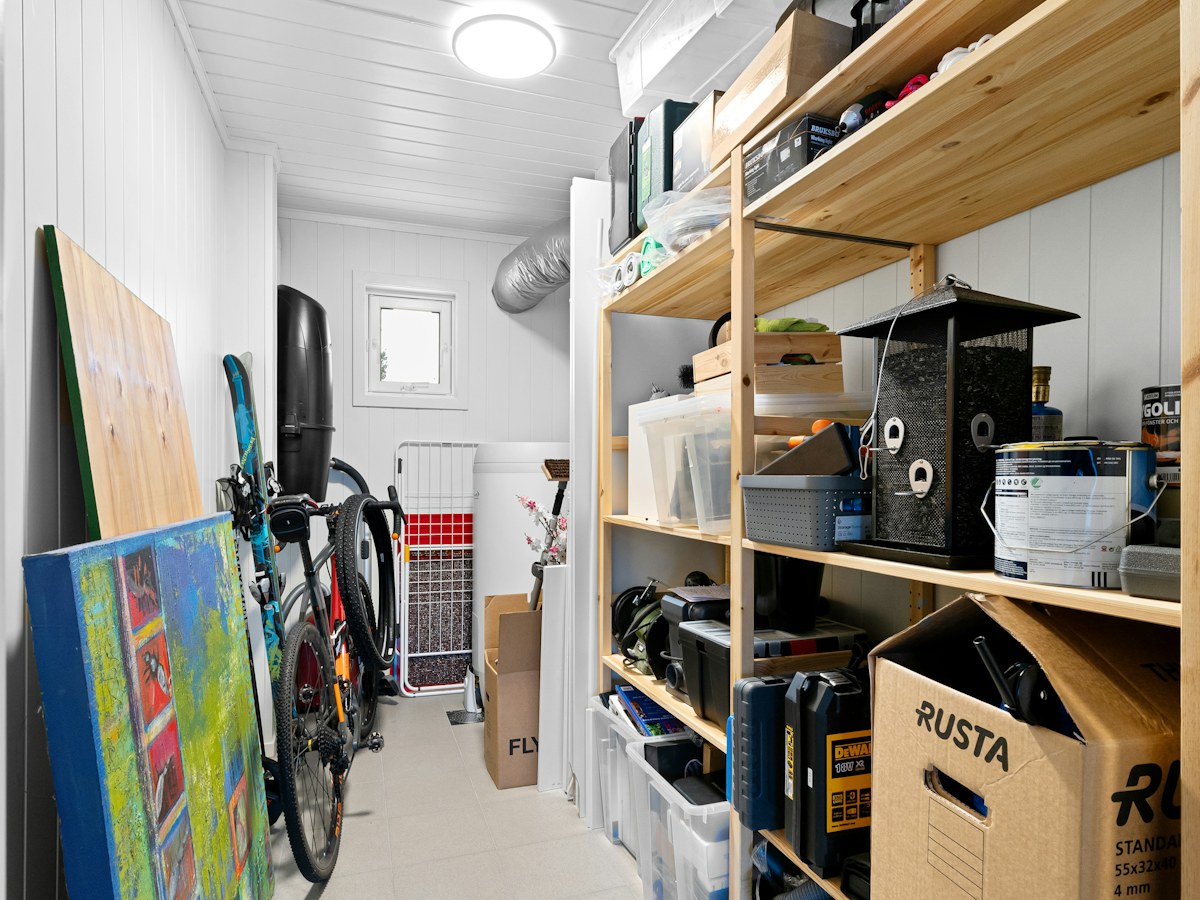 A long narrow room with a lot of storage